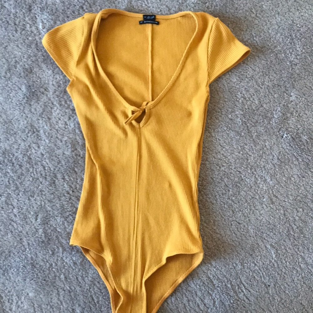 Never worn, yellow bodysuit from Urban outfitters